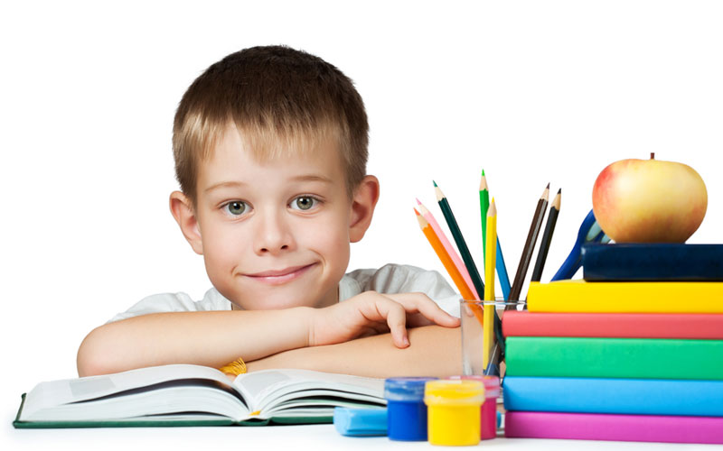 nice boy with books and pencils